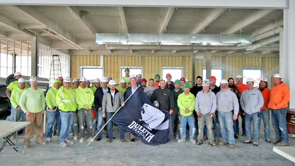 Construction workers topping out - Duluth Trading