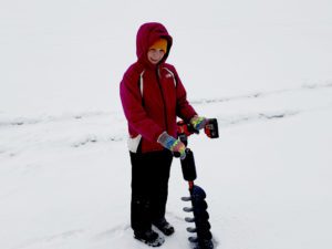 Mike's son holding the ice auger