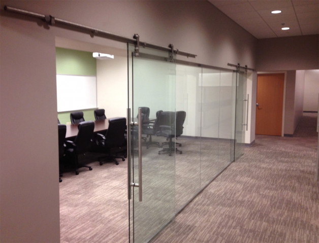 Close up of beautiful tempered glass sliding office doors