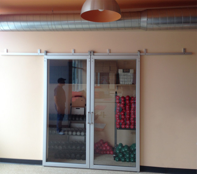 Custom glass sliding door we installed in a yoga studio