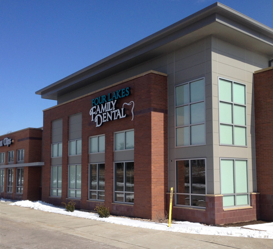 New construction glass - A retail building on Cottage Grove Road includes a Great Clips and Dental business
