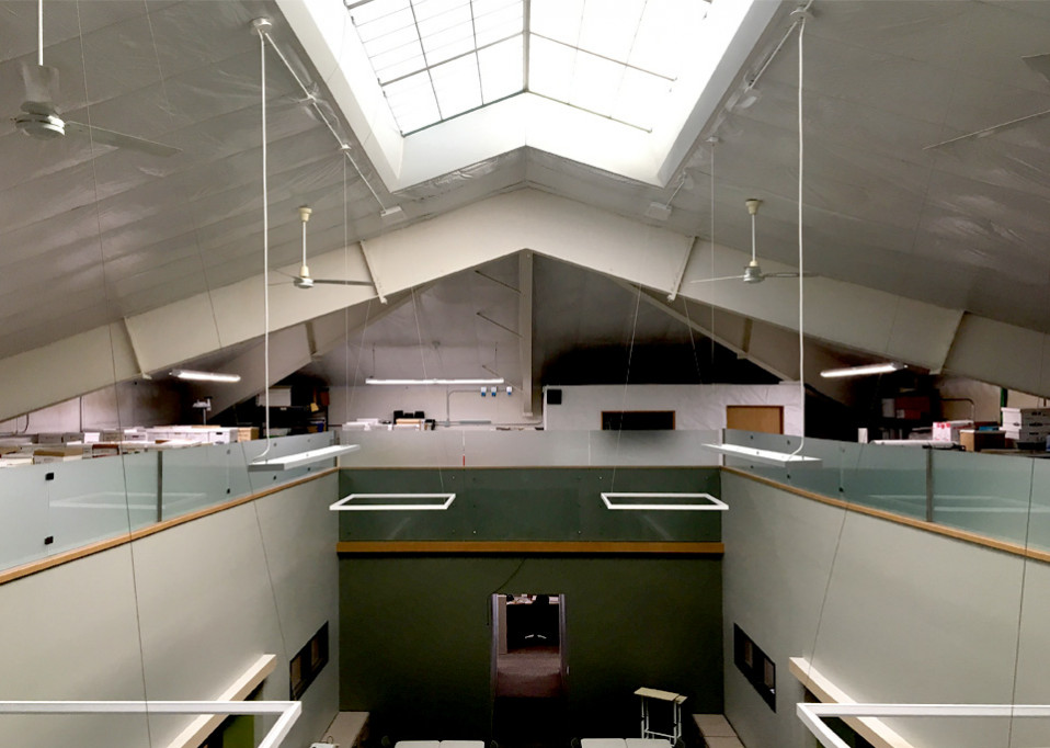 Office mezzanine with frosted glass railing