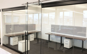 Interior glass offices with custom pipeline slide door