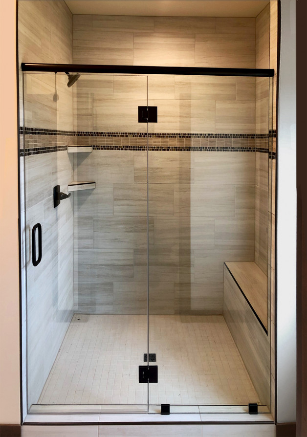 Shower enclosure with oil-rubbed bronze finishes