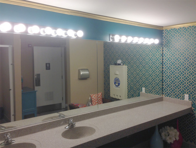 Ladies room bathroom mirror installed in a furniture store in Wisconsin